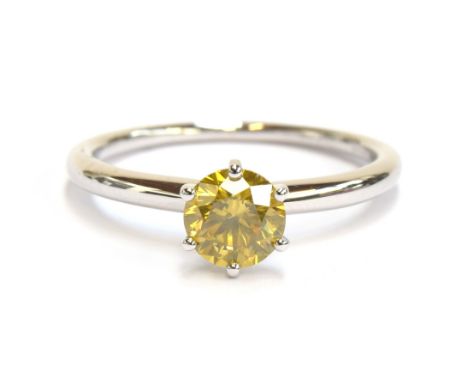 A platinum mounted yellow canary diamond solitaire ring, the diamond weighing 1ct, size S, 4.6g 