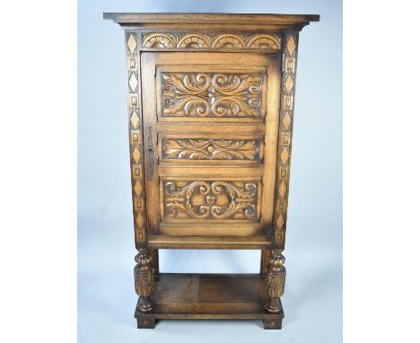 A Mid 20th Century Carved Wooden Cabinet, The Panelled Door to Three Shelf Interior, Pot Board Shelf and Carved Bulbous Suppo