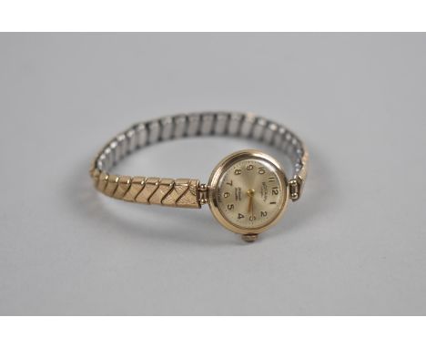 A 9ct Gold Ladies Rotary Wrist Watch, Champagne Dial with Gilt Arabic Numerals, 24 Jewel Incabloc Movement, Case 19.5mm Diame