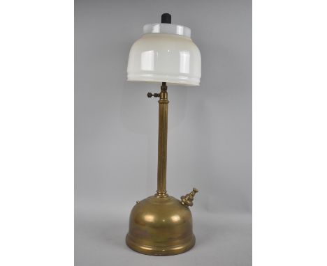 A Late Victorian/Edwardian Brass Paraffin Lamp with reeded Support and Opaque Glass Shade, 54cms High 