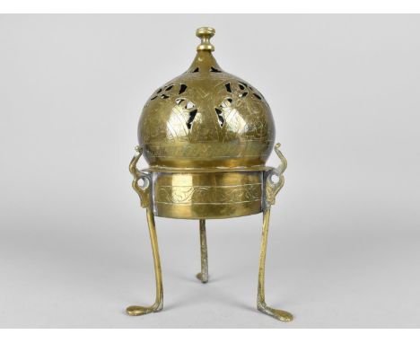 An Eastern Islamic Brass Censer with Pierced Dome Top and Tripod Base, 23cms High 