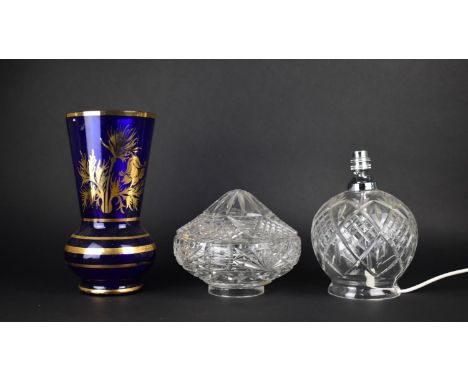 A Cut Glass Table Lamp Base Together with a Cut Glass Shade and a Blue Glass Vase Decorated in Gilt 