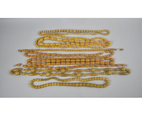 A Collection of Various Vintage Amber Style Bead Necklaces 
