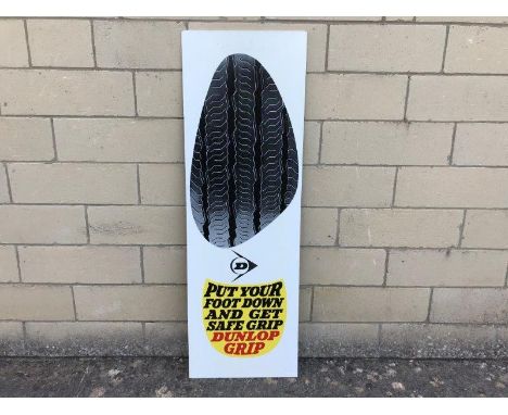 A 1960s Dunlop hardboard advertising sign - Put Your Foot Down and Get Safe Grip, 16 x 48".