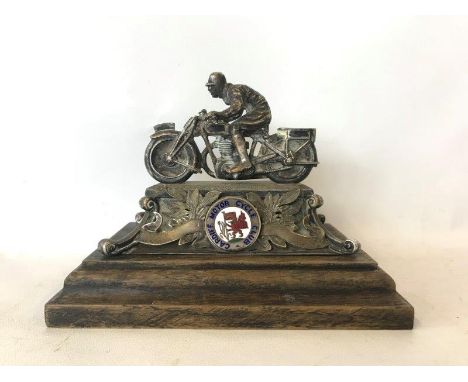 A rare Cardiff Motor Cycle Club desk top trophy depicting a motorcyclist on a flat tank motorcycle, oak base mounted.