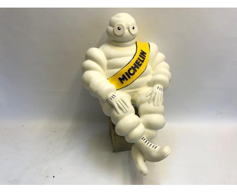 A large contemporary Michelin Mr. Bibendum figure on bracket, 22" tall.