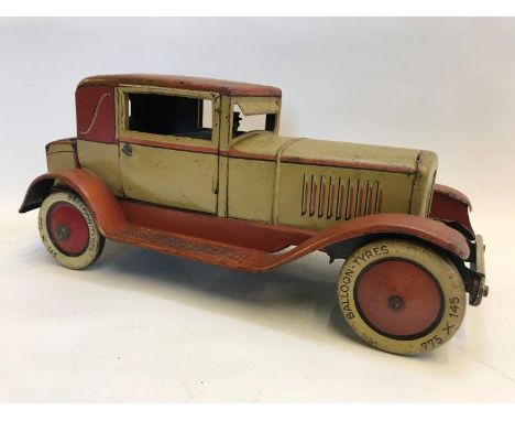 A clockwork tinplate model of a vintage motor car, stamped: Made in Germany JDN.