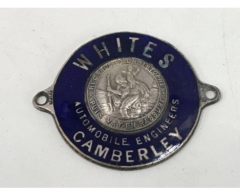 An enamel dealership supply plate for Whites Automobile Engineers of Camberley, with central St. Christopher badge.