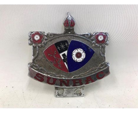 A Sunbac part enamel car badge. 