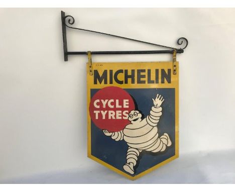 A Michelin Cycle Tyres double sided aluminium advertising sign depicting Mr. Bibendum running, on a metal bracket, 15 3/4 x 2