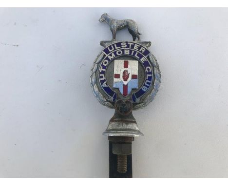 An Ulster Automobile Club part enamel car badge stamped no. 217.