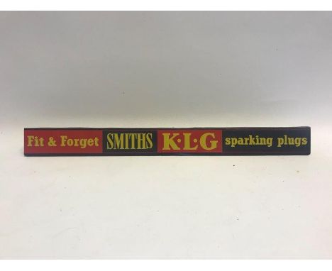 A Smiths KLG Sparking Plugs 'Fit and Forget' shelf strip, in good condition.