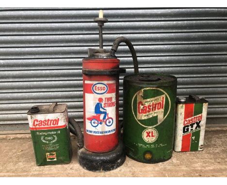 A Wakefield Castrol Motor Oil five gallon drum, two Castrol gallon cans and an Esso two stroke mixer. 