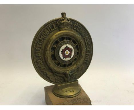 A Royal Automobile Club Associate car badge with Northamptonshire enamel centre and celluloid backing for 1916, stamped V46.