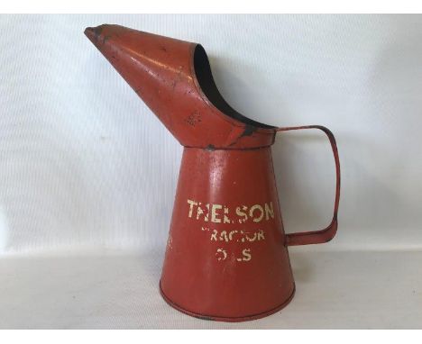 A Thelson Tractor Oils quart oil measure.