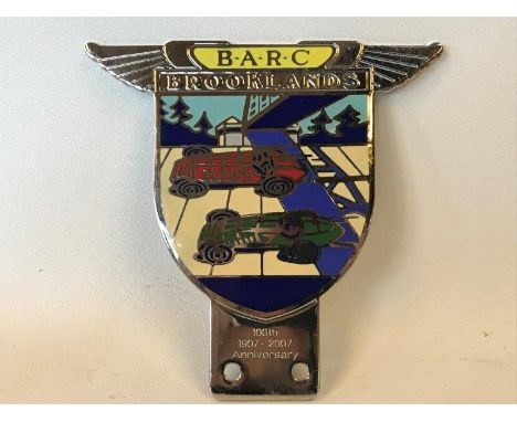 A Brooklands 100th anniversary enamel car badge by Toye Kenning and Spencer.