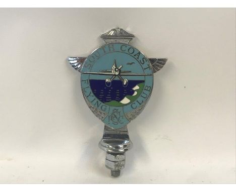 A rare South Coast Flying Club enamel car badge, circa 1930, stamped to reverse: 129 Colins London. 