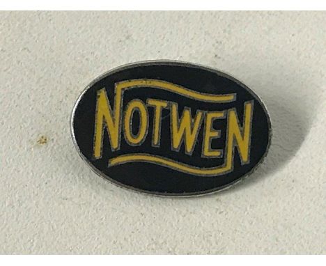 A Notwen black and yellow enamel lapel badge by Gaunt.