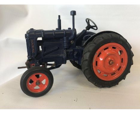 A Chad Valley Fordson die-cast model tractor.
