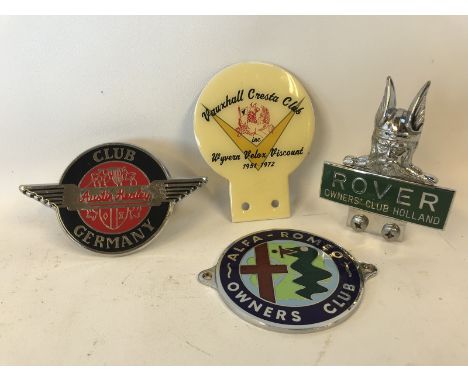 An Austin Healey Club of Germany car badge, an Alfa-Romeo Owner's Club badge, a Rover Owner's Club of Holland badge and a Vau