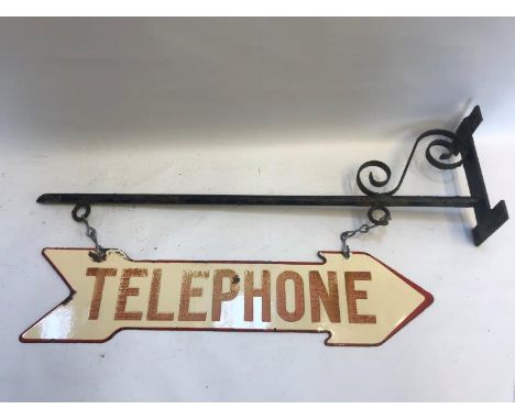A double sided Telephone directional enamel sign hanging on a bracket with chains, 22 1/2 x 5 1/2" (measurements for sign onl