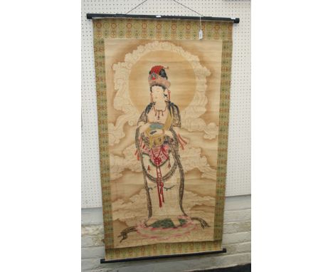 A Chinese 20th century painted scroll, depicting Guan Yin on a lotus socle with silk brocade border, 143 x 75cm