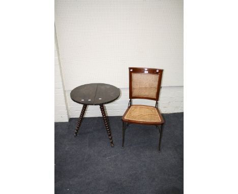 A wrought iron and split cane vintage bistro chair, together with a bobbin turned 'Gypsy' type table