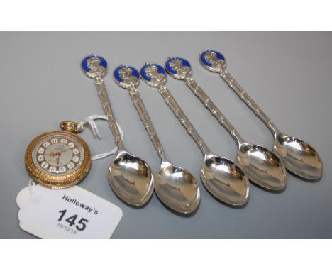 A lady's plated and enamel pocket watch with jeweled movement together with five silver and enamel commemorative teaspoons de