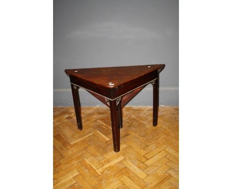 A George III mahogany Chippendale style triangular folding table with shaped pierced detail