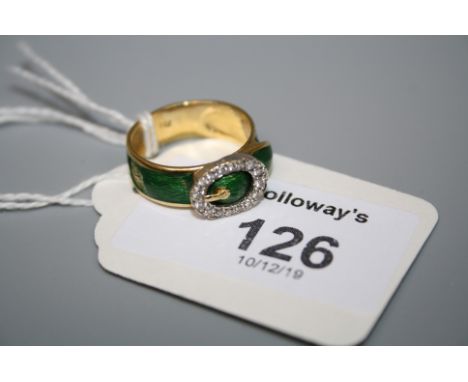 A diamond and enamel buckle ring, the oval buckle set with brilliant cut diamonds, with green guilloche enamelled band formin