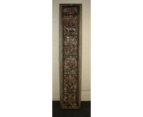 An Indian carved and painted architectural panel with Ganesh and Brahmin bull motif, 193cm high