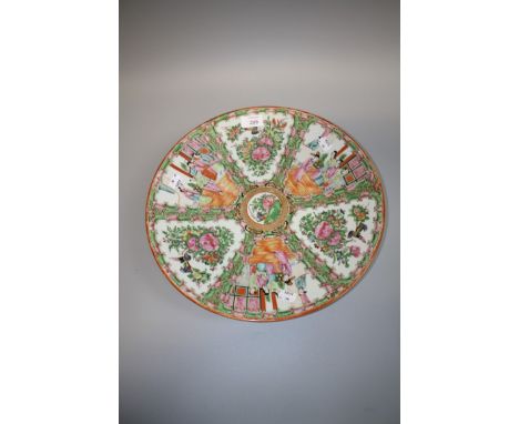 A 19th century Chinese porcelain, Canton enamel famille rose charger, with panels of figures, 38cm diameter