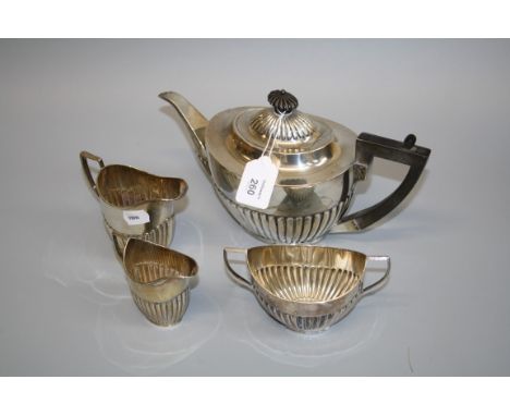 A marked four piece teaset, oval part fluted, the teapot with ebonised finial and angled handle, teapot Sheffield 1905 by Map