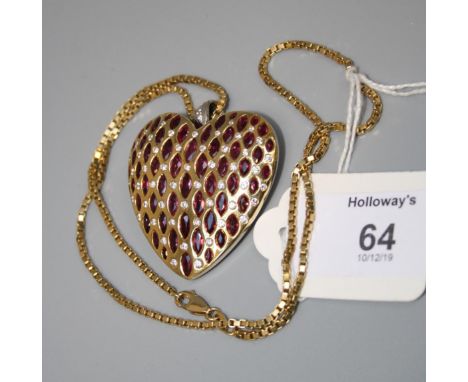 The Jewel Label by Uma Agarwal, a large ruby and diamond set heart pendant, set with bands of marquise shaped rubies and alte