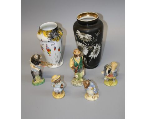 A collection of Beswickware and other ceramic figures, including 'Daniel', 'Tom Kitten', 'Otter Fisherman' and other figures 