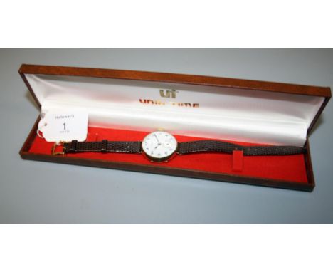 J W Benson, a gentleman's 9ct gold wristwatch, the circular white enamel dial with Arabic numerals and subsidiary seconds at 