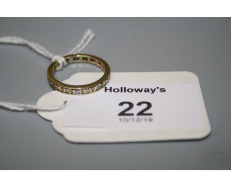 A full hoop diamond eternity ring, the brilliant cut diamond within claw mounted band, unmarked, Ring size k1/2  1.5g