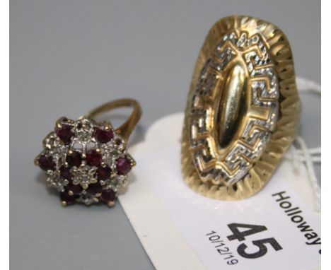 A 14ct gold dress ring, oval with embossed Greek key design, and a ruby and diamond cluster ring, 6.2g gross weight