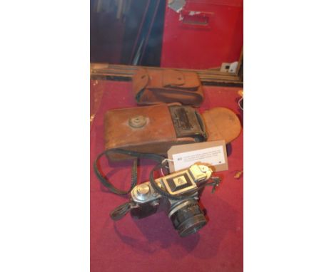 A Kodak junior bellows camera in tan leather case with instruction book together with an Asahiflex No 61633 and another Bello
