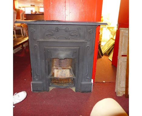 An east iron fireplace with Art Nouveau detail 