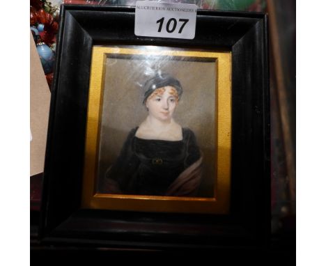 A Victorian miniature portrait of a lady glazed and in an ebonised frame with details verso 