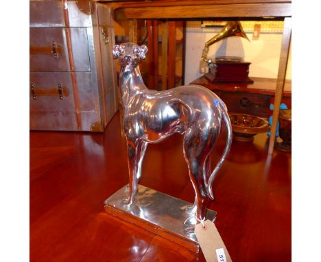 A silvered resin model of a greyhound 