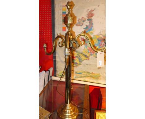 A large brass triple branch hanging light and a collection of brass fireside tools 