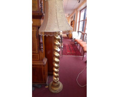 A gilded column form standard lamp 