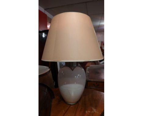 A white glazed pottery table lamp 