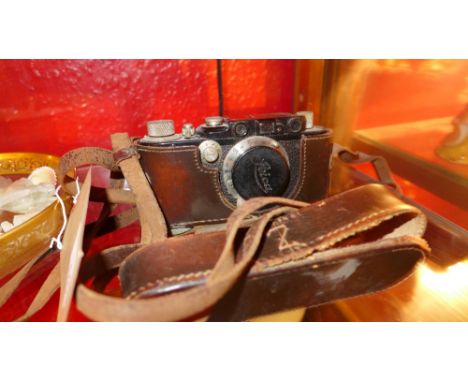 A 1930's Leica Ernst Leitz Wetziar camera. No 111801, in tan leather case 