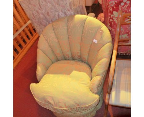 An Art Deco shell back tub chair newly upholstered in green and peach coloured damask 