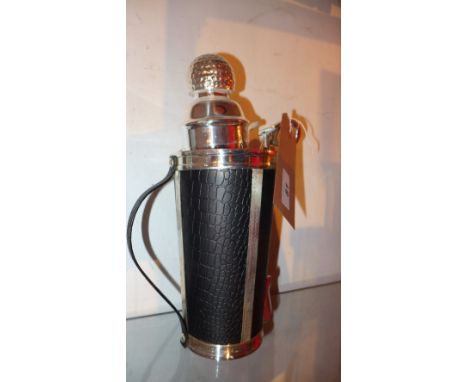 A silver plated cocktail shaker in the form of a golf caddy 