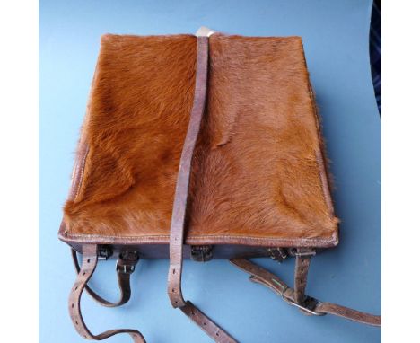 A 1950's cow hide Swiss army backpack having leather straps and fittings, stamped to the interior 
