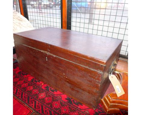 An early 20th century Colonial teak trunk of small proportions having twin handles 